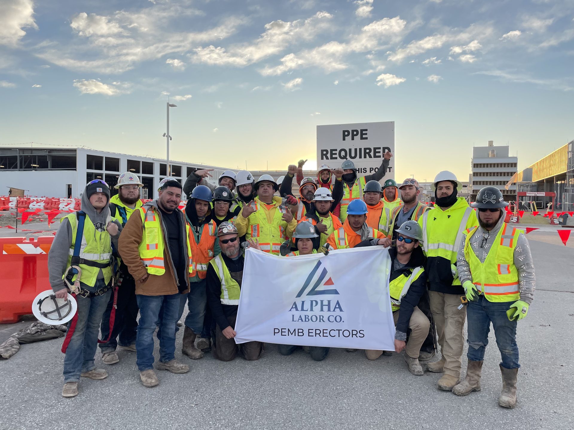 Aerial view of Alpha Labor Co. PEMB roofing crew at work